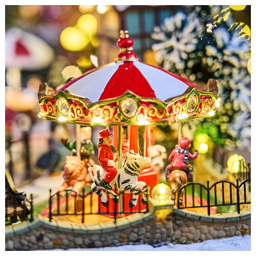 Winterszene „Stadtansicht“ mit LEDs, Schlittschuhläufern und Karussell – 60 × 50 × 25 cm, Strombetrieb 4