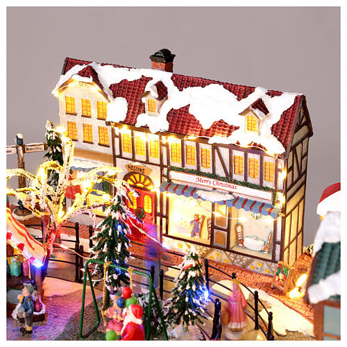 Christmas Village: colourful city with skaters and carousel in motion, LED lights, 24x20x10 in, electricity 7