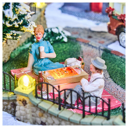 Pueblo navideño ciudad patinadores carrusel movimiento LED coloridos 60x50x25 cm eléctrico 9