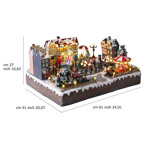 Pueblo navideño ciudad patinadores carrusel movimiento LED coloridos 60x50x25 cm eléctrico 3