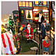 Pueblo navideño ciudad patinadores carrusel movimiento LED coloridos 60x50x25 cm eléctrico s10