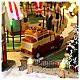 Pueblo navideño ciudad patinadores carrusel movimiento LED coloridos 60x50x25 cm eléctrico s11