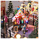 Pueblo navideño ciudad patinadores carrusel movimiento LED coloridos 60x50x25 cm eléctrico s13