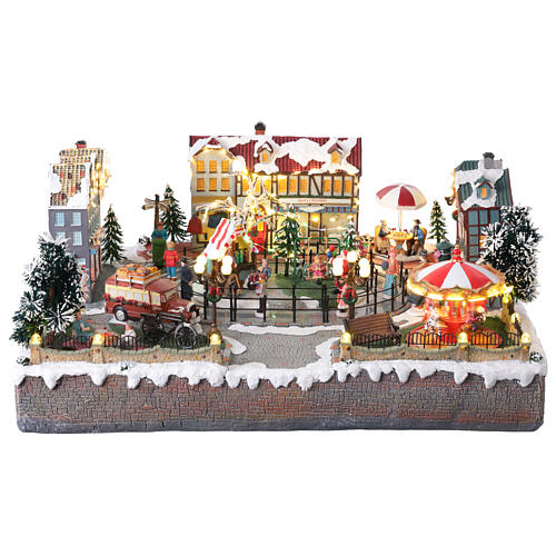 Villaggio Natalizio città pattinatori giostra movimento LED colorati 60x50x25 cm corrente 1