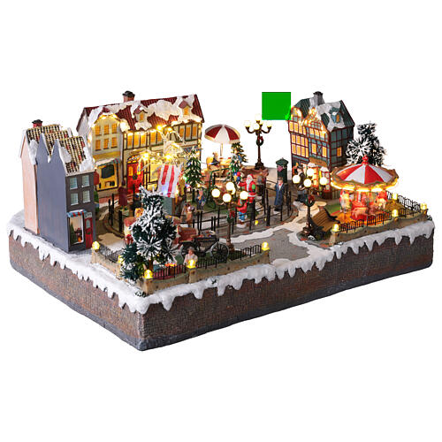 Villaggio Natalizio città pattinatori giostra movimento LED colorati 60x50x25 cm corrente 9