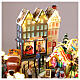 Villaggio Natalizio città pattinatori giostra movimento LED colorati 60x50x25 cm corrente s7
