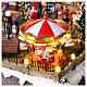 Villaggio Natalizio città pattinatori giostra movimento LED colorati 60x50x25 cm corrente s12