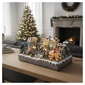 Cenário natalino cidade com patinadores carrossel movimento LEDs coloridos 60x50x25 cm corrente