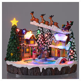 Villaggio Natalizio illuminato pattinatori in movimento con musica 20x15x18 cm