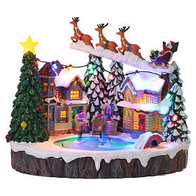 Villaggio Natalizio illuminato pattinatori in movimento con musica 20x15x18 cm