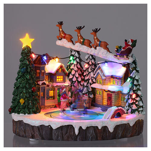 Villaggio Natalizio illuminato pattinatori in movimento con musica 20x15x18 cm 2