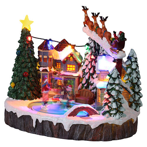 Villaggio Natalizio illuminato pattinatori in movimento con musica 20x15x18 cm 3