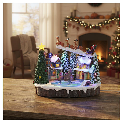 Cenário natalino iluminado com patinadores em movimento e música 20x15x18 cm 2