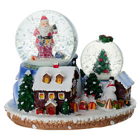 Boule à neige cadeaux Père Noël et village 15x10x12 cm