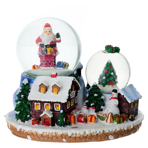 Palla di neve regali Babbo Natale e villaggio 15x10x12 cm 1