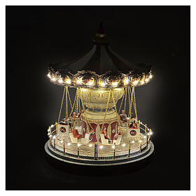 Carillon giostra con seggiolini animata led e musica 25x25x30 cm