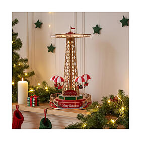 Weihnachtskarussell mit Fallschirmen, animiert, LEDs und Musik – 25x25x45 cm