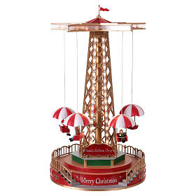 Christmas carousel with animated parachutes, lights, and music, 10x10x18 in