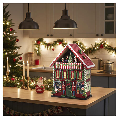 Calendario de Adviento tienda de juguetes Papá Noel animado 40x15x55 cm 2