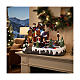 Casa di Natale con pattinatori sul ghiaccio animati 35x20x25 cm s2