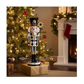 Black, white, and gold nutcracker with a stick, 16 in, resin