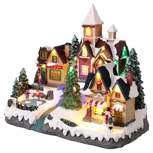 Christmas village scene with animated skaters and lights, 14x8x12 in 3