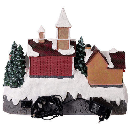 Village de Noël avec patineurs animés et lumières 35x20x30 cm 5