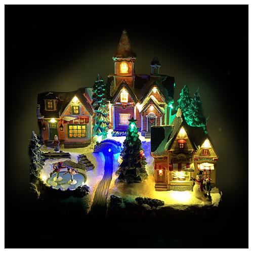 Christmas village scene with animated skaters lights, 35x20x30 cm 2