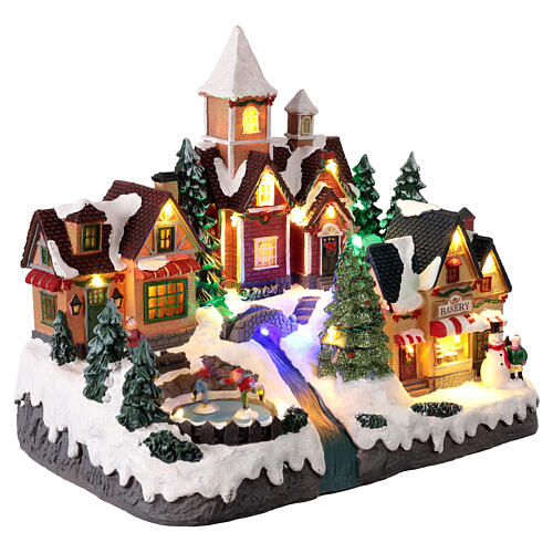 Christmas village scene with animated skaters lights, 35x20x30 cm 4