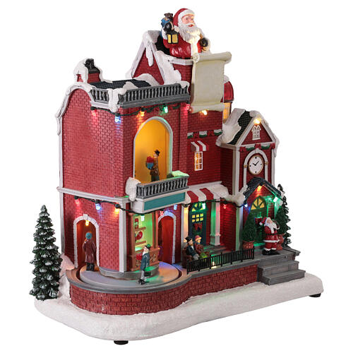 Casa roja de Papá Noel led animada con música 30x20x35 cm 4