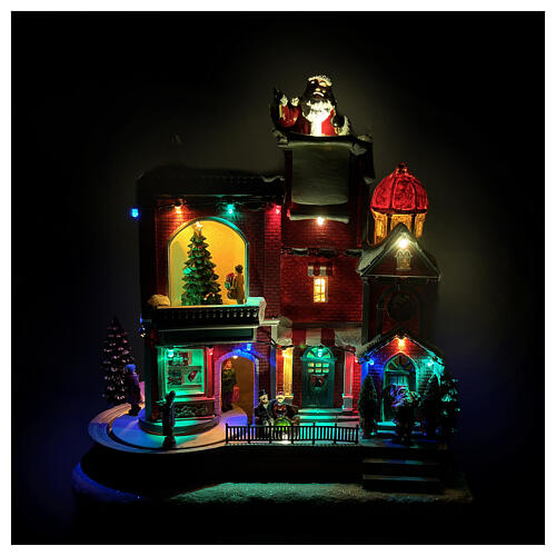 Maison rouge du Père Noël animée par des LEDs et musique 30x20x35 cm 2
