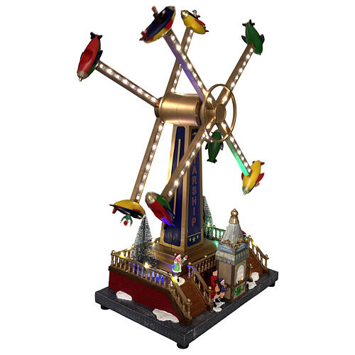 Carrousel aviones navideño animado luces y música 40x20x50 cm 4