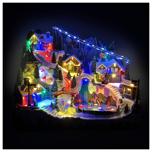 Scena di montagna con bambini che pattinano animati luci e musica 55x35x40 cm 2
