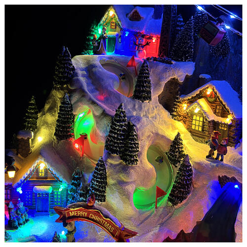 Scena di montagna con bambini che pattinano animati luci e musica 55x35x40 cm 4