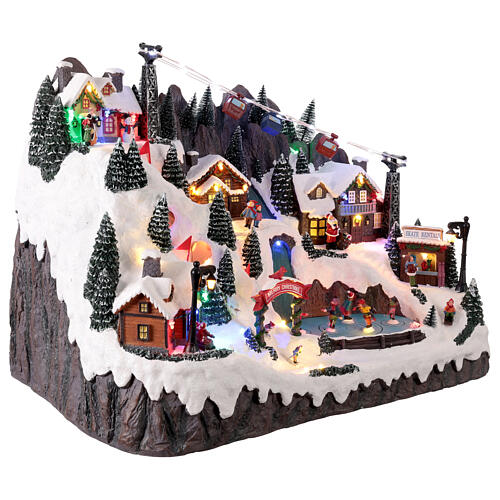 Scena di montagna con bambini che pattinano animati luci e musica 55x35x40 cm 5