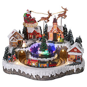 Christmas village with animated Santa's sleigh, lights and music, 13x10x11 in