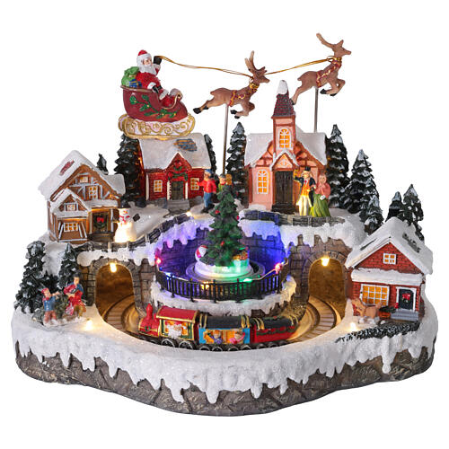 Aldea de Navidad con trineo de Papá Noel animado, luces y música 35x25x25 cm 1