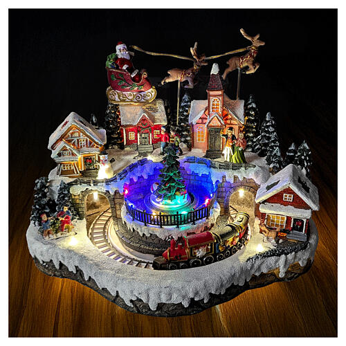 Aldea de Navidad con trineo de Papá Noel animado, luces y música 35x25x25 cm 2