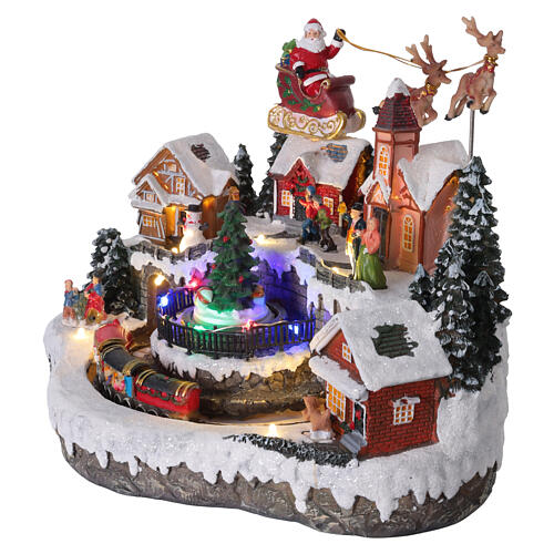Aldea de Navidad con trineo de Papá Noel animado, luces y música 35x25x25 cm 3