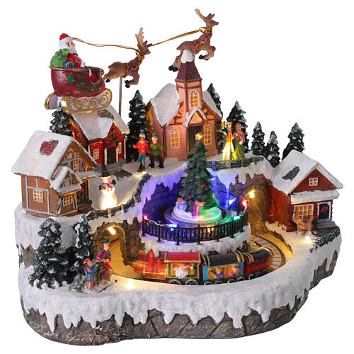 Aldea de Navidad con trineo de Papá Noel animado, luces y música 35x25x25 cm 4