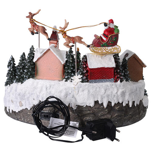 Aldea de Navidad con trineo de Papá Noel animado, luces y música 35x25x25 cm 5
