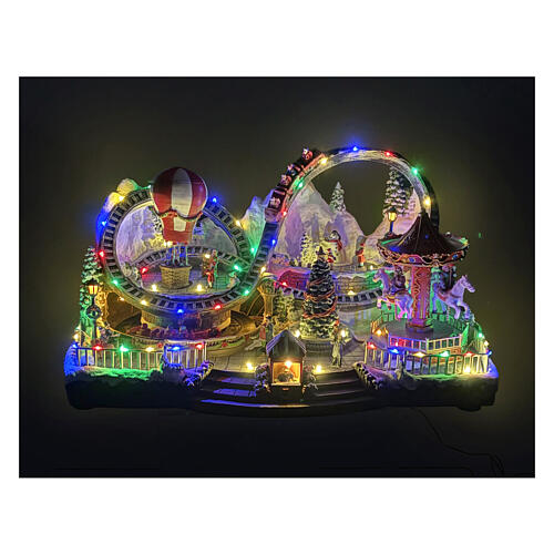 Weihnachtliche Fahrgeschäft-Szene, animiert mit Licht- und Musikfunktion – 55 × 35 × 30 cm 2