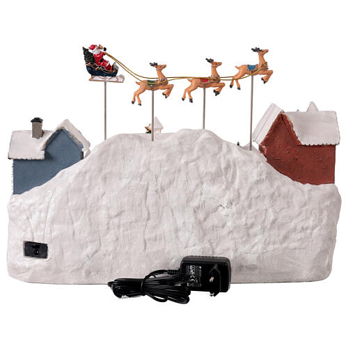 Villaggio di Natale con renne e Babbo Natale volanti animati luci e musica 40x25x30 cm 5