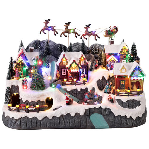 Pueblo montañoso con arroyo y patinadores animados luces y música 60x35x40 cm 1