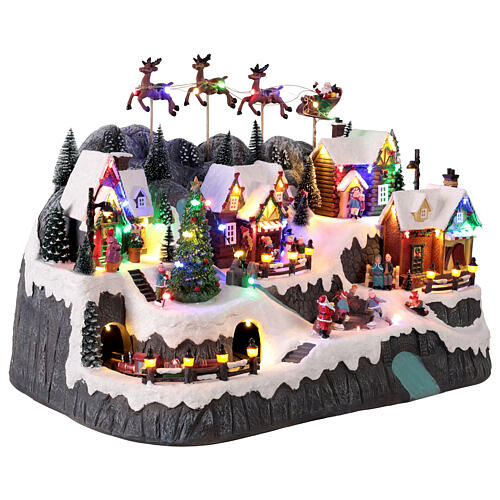 Villaggetto di montagna con ruscello e pattinatori animati luci e musica 60x35x40 cm 5