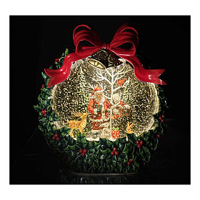 Ghirlanda agrifogli palla di neve Babbo Natale neve, luci e musica 20x10x20 cm