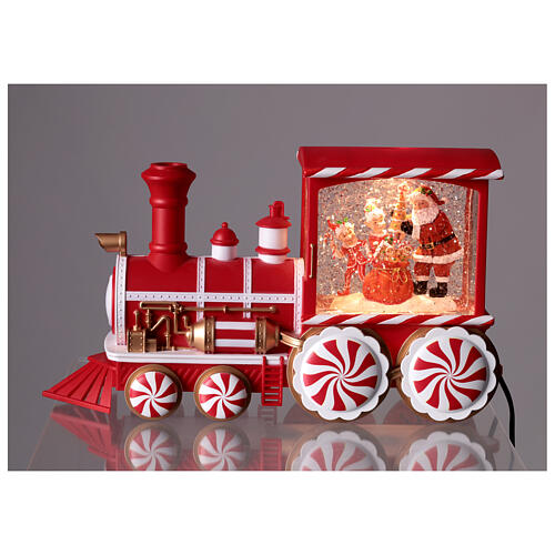 Boule à neige locomotive de bonbons musique et lumières 30x10x15 cm 2