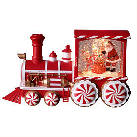 Locomotiva con neve caramelle musica e luci 30x10x15 cm