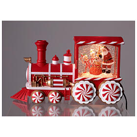Locomotiva con neve caramelle musica e luci 30x10x15 cm