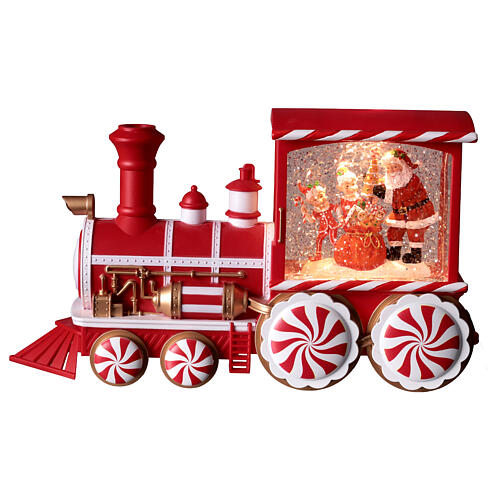 Locomotiva con neve caramelle musica e luci 30x10x15 cm 1